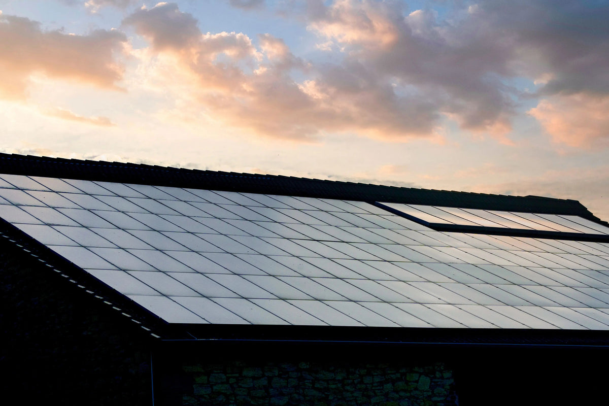 All-black solar panels installed by Senga Energy on a Gold Country rooftop at sunset