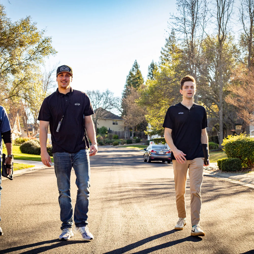 Senga Energy solar team members walking in a California neighborhood, representing trusted local installers serving Gold Country homeowners