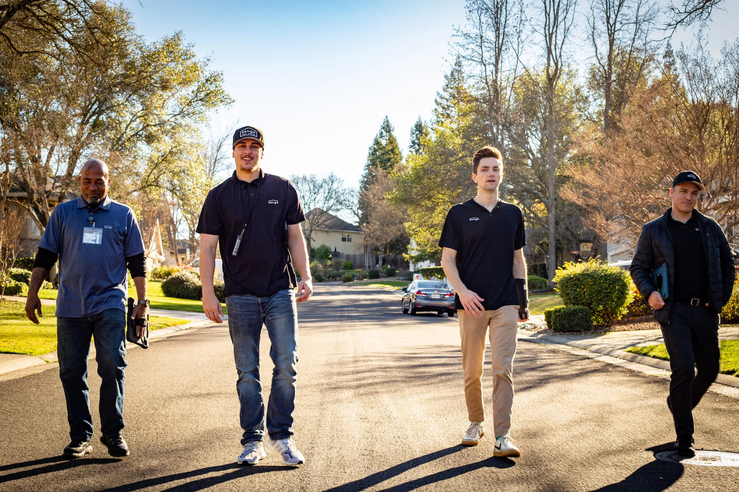 Senga Energy solar team members walking in a California neighborhood, representing trusted local installers serving Gold Country homeowners