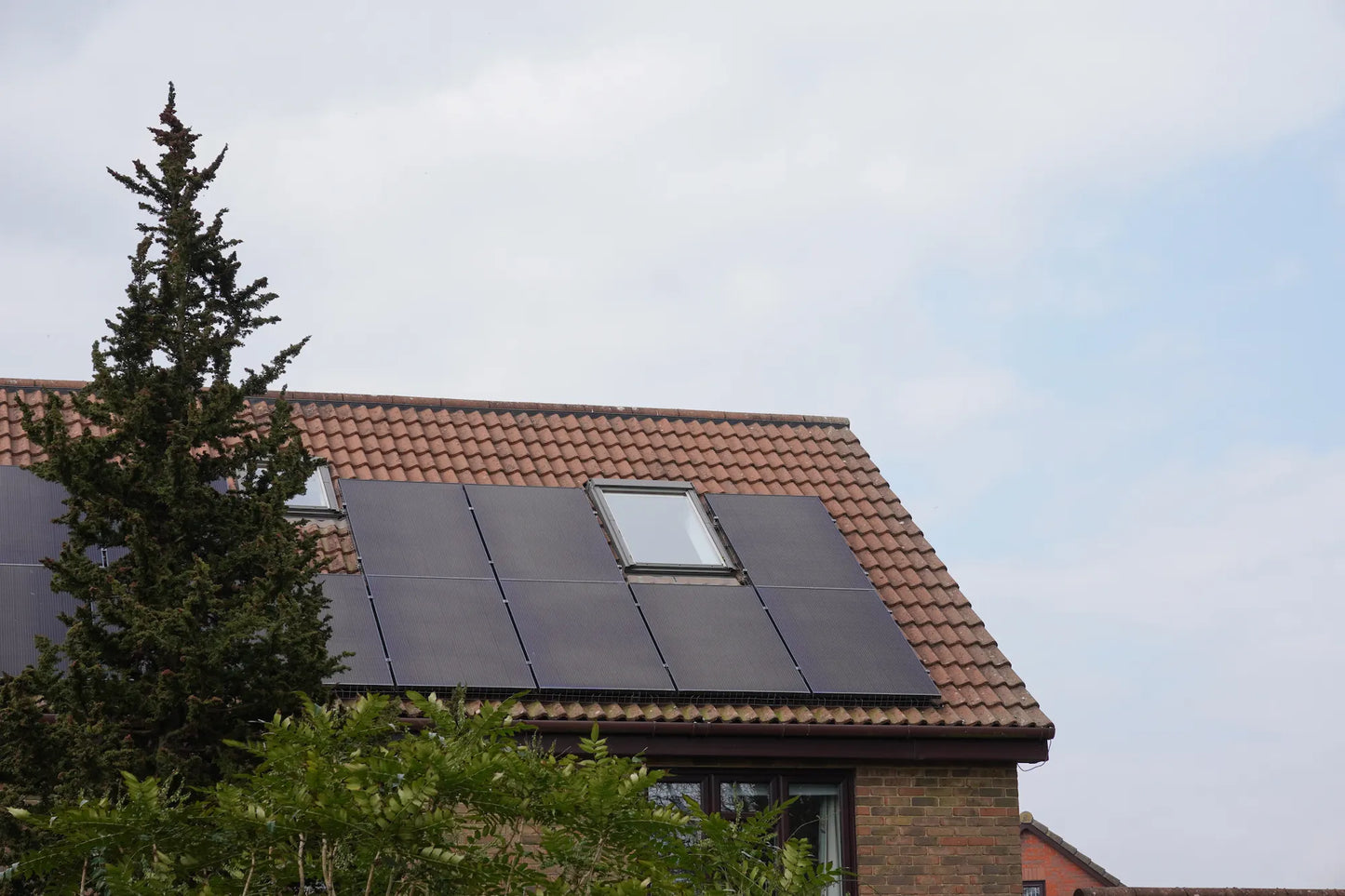Residential solar panels installed on a roof by Senga Energy, with battery storage to lower monthly electric bills in Gold Country, California