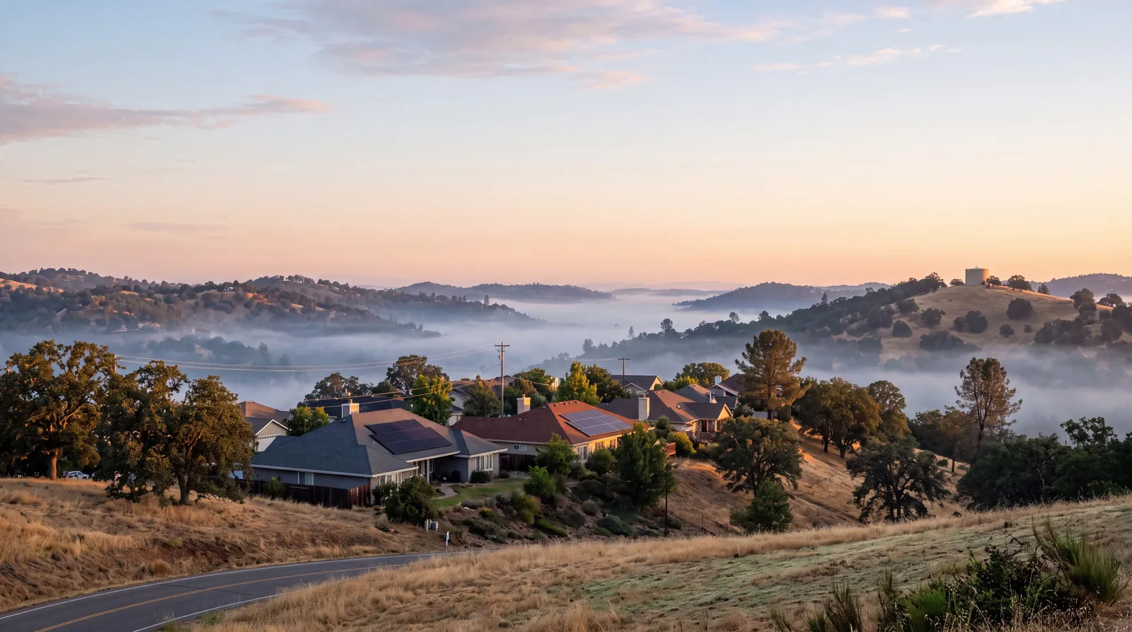 Sunrise over Gold Country foothill homes in Senga Energy's solar service area
